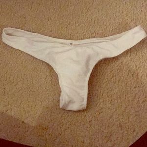 White swim bottom thong *never worn *fits like M/L